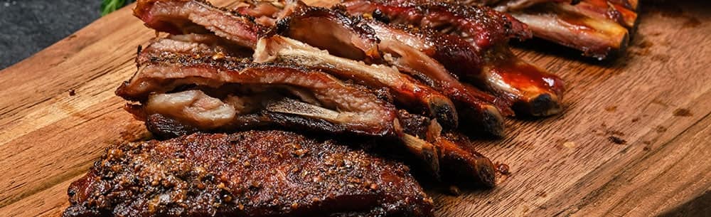 ribs on a wood plank resting
