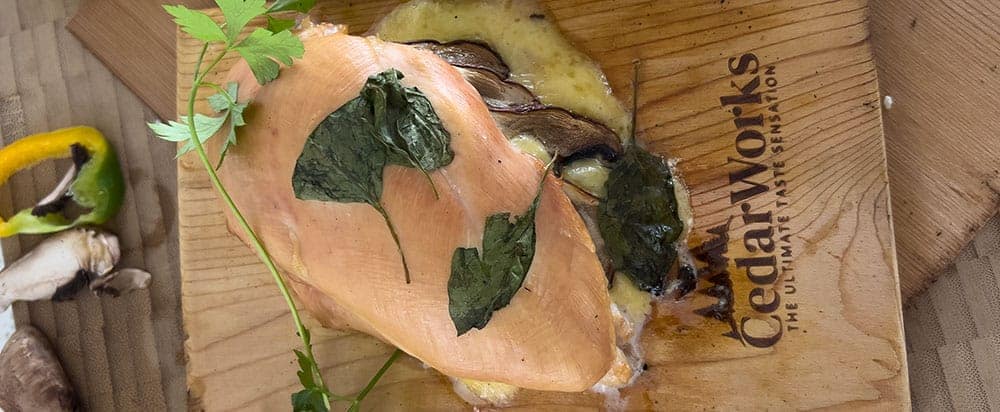 Stuffed chicken on a CedarWorks grilling plank