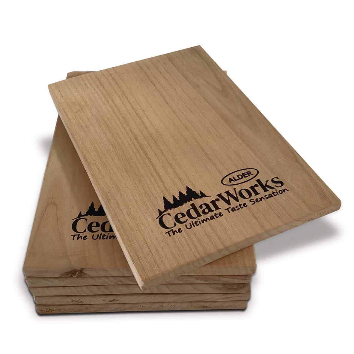 Smooth cedar wood chopping boards with Alder Cedar Works logo, ideal for kitchen prep and food presentation, showcasing durable, eco-friendly timber craftsmanship.