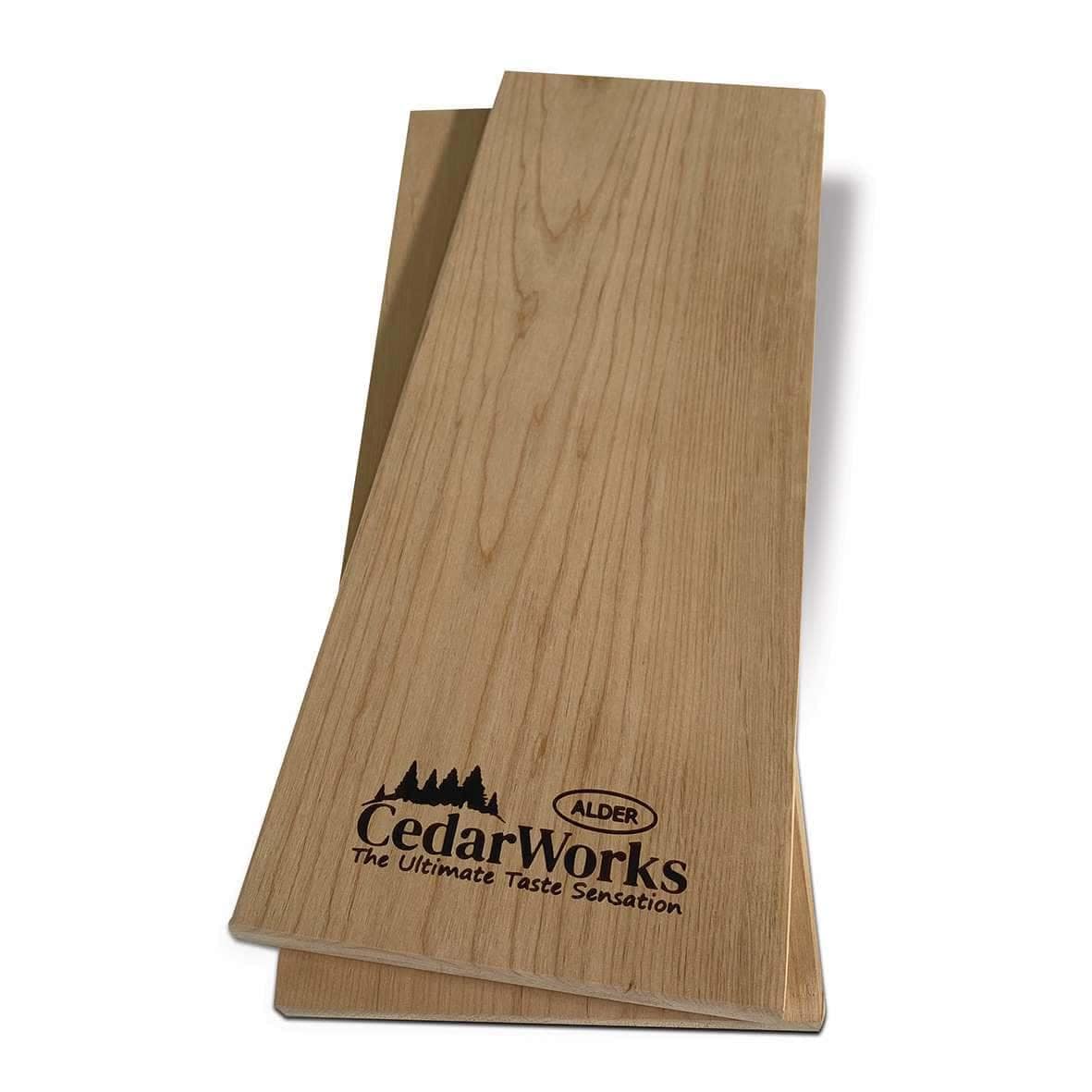 Smooth cedar wood cutting board with Cedar Works logo, perfect for kitchen prep and outdoor barbeques, showcasing quality craftsmanship and natural timber appeal.