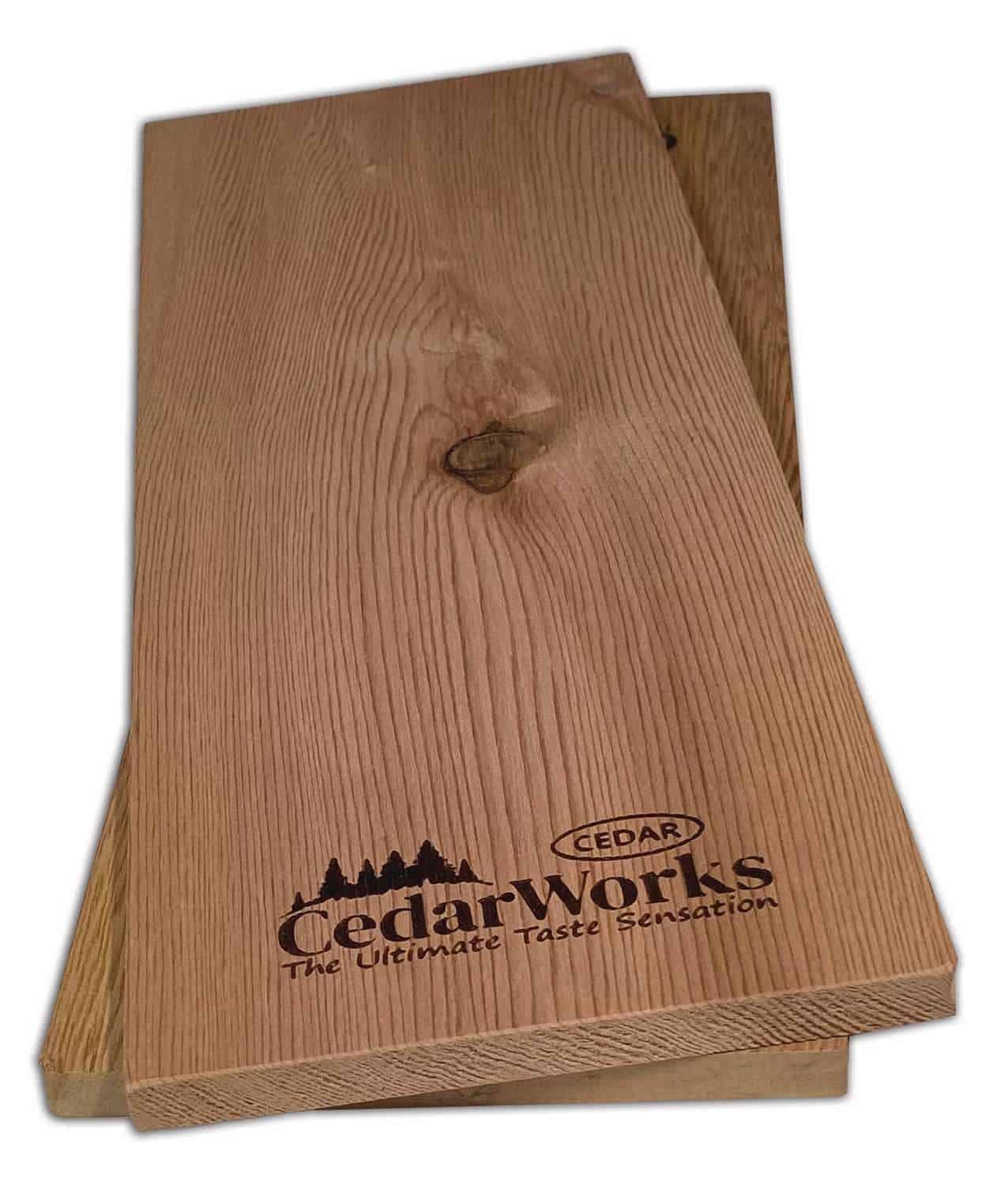 Smooth cedar wood sample with natural grain, featuring Cedar Works branding and tagline "The Ultimate Taste Sensation". Ideal for custom woodworking, furniture, or decking projects.