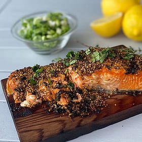 salmon with spices on a grilling plank