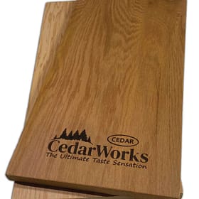 Carefully crafted cedar wood sample with Cedar Works logo and branding for high-quality timber products.