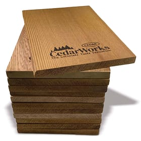 Smooth cedar wood sample slats showcasing natural grain and finish, branded with Cedar Works logo, emphasizing premium quality cedar products for furniture and craftsmanship.