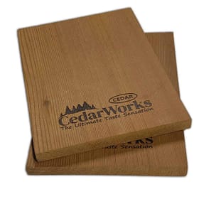 Sustainable cedar wood tasting boards with engraved Cedar Works logo, ideal for cheese and appetizer presentations. Perfect for enhancing dining experiences with natural wooden elegance.