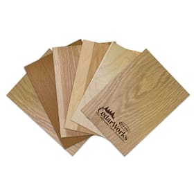 Rich wooden veneer samples showcasing natural grain patterns and warm tones for custom woodworking, furniture, and interior design projects.