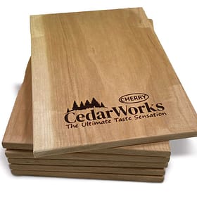 Silicone board with Cedar Works logo and cherry trees, perfect for serving and presentation. Crafted from high-quality wood with custom logo engraving. Enhances any dining or catering experience.