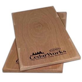 Handcrafted cedar wood coasters with Cherry Cedar Works logo, showcasing natural wood grain and premium quality craftsmanship for home decor and indoor/outdoor use.