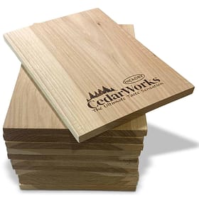 Sustainable cedar wood sample stack with Cedar Works and Hickory logos, ideal for custom woodworking projects and outdoor furniture.
