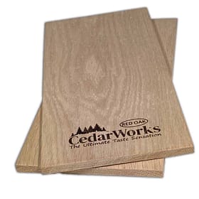 Smooth finished cedar wood sample showing natural grain patterns, branded with Cedar Works logo for premium custom cedar wood products.