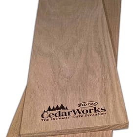 Smooth red oak wood chopping board with Cedar Works logo, ideal for kitchen prep and presentation, showcasing high-quality craftsmanship and durable construction.