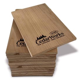 Smooth cedar wood tasting boards with Cedar Works and Alder branding, perfect for serving cheese and appetizers. Durable, stylish, and made from high-quality cedar wood. Ideal for gourmet food presentation.