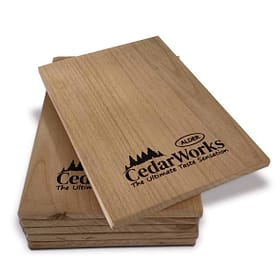 Smooth cedar wood chopping boards with Alder Cedar Works logo, ideal for kitchen prep and food presentation, showcasing durable, eco-friendly timber craftsmanship.