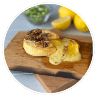 camembert cheese on a cedar grilling plank