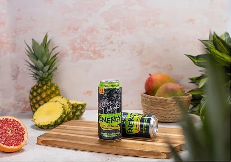 Vegan energy drinks on a wooden cutting board with pineapples, apples, and grapefruit in a fresh, vibrant kitchen setting. Perfect for healthy lifestyle and natural energy boost.